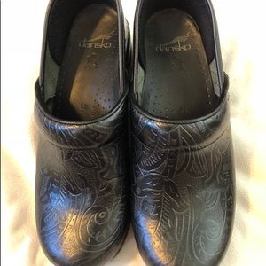 Never worn black floral Dansko’s